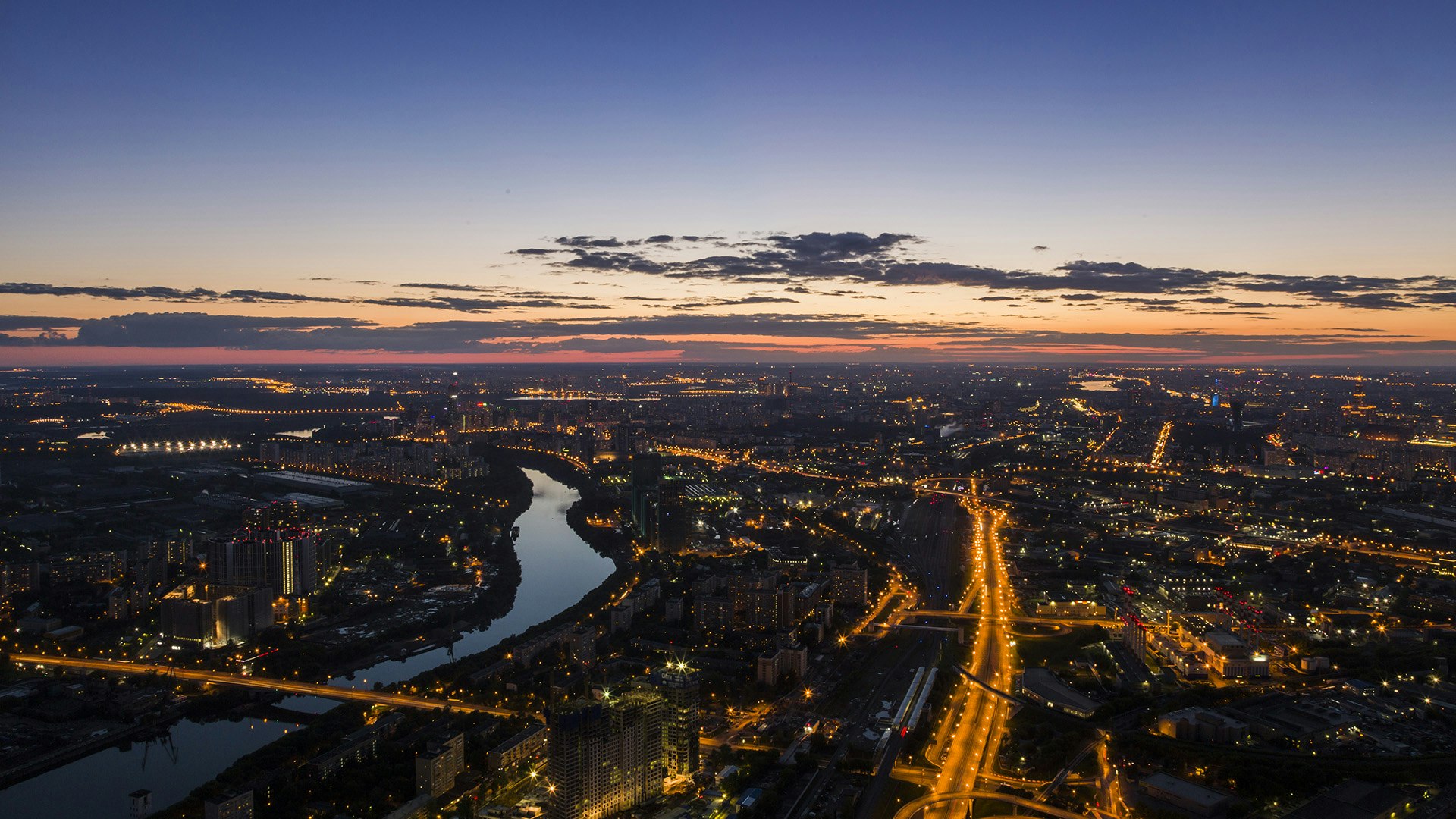 birds eye view of a a city at sunset